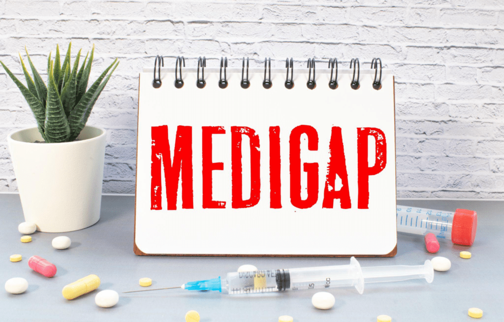 Medigap text written in a notebook lying on a desk.