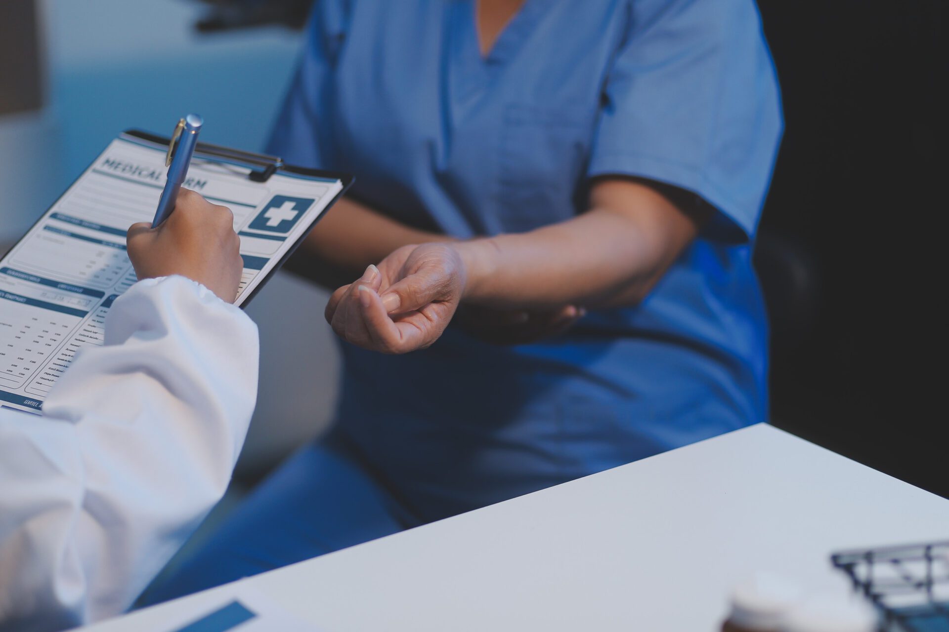 Charming female doctor giving advice to a female patient.